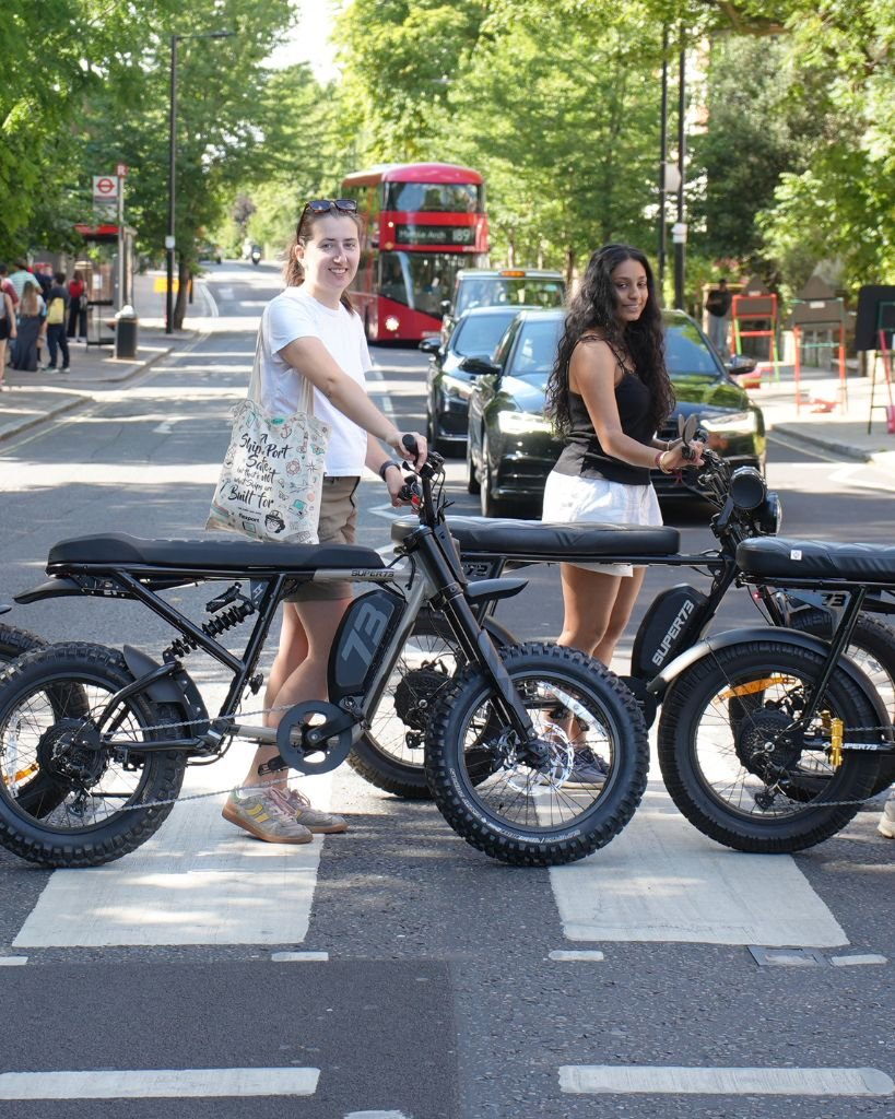 Guests on Super73 e-bikes posing at the Abbey Road crossing during a Beatles London e-bike tour
