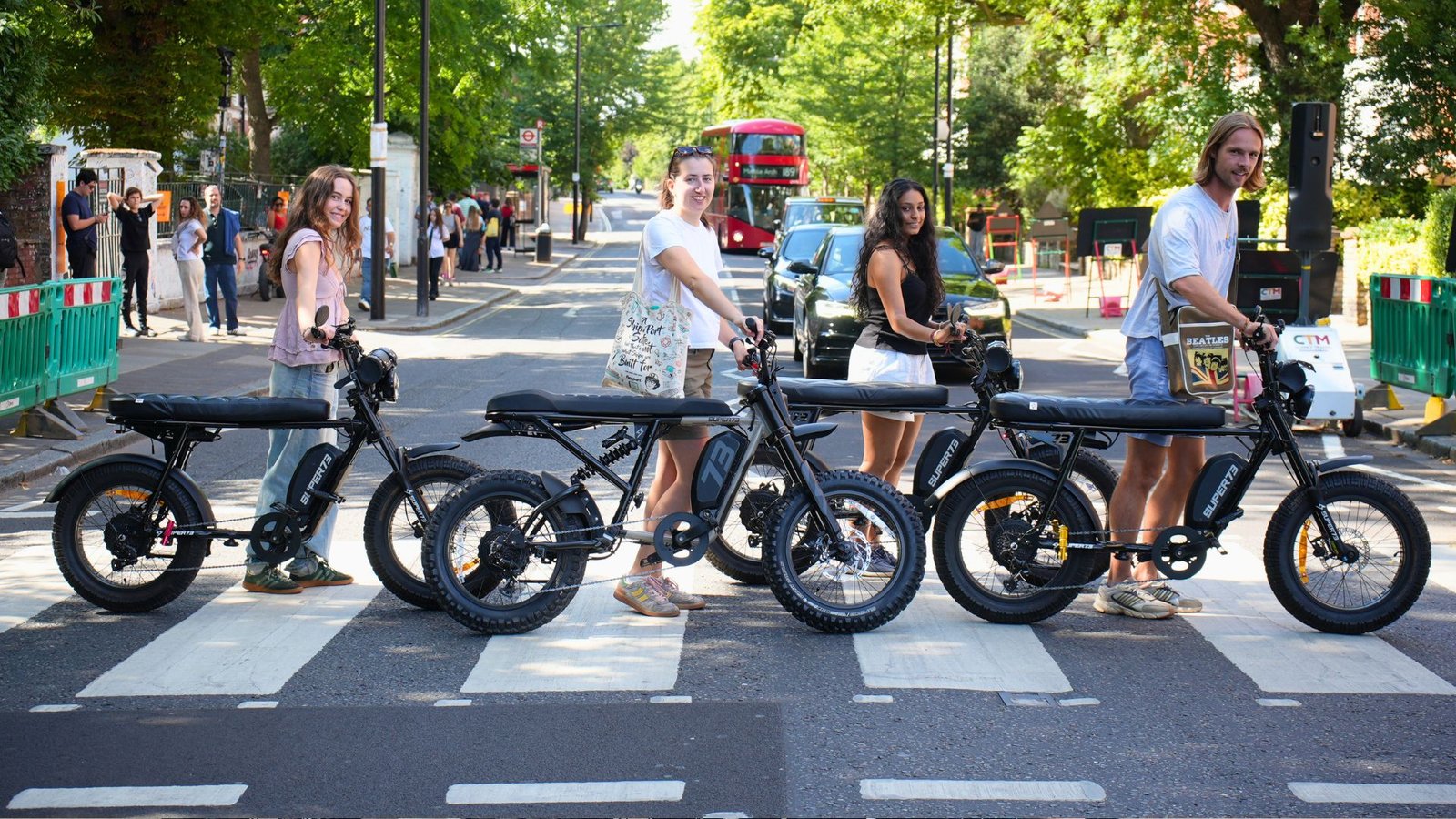 Guests on the FOF Bike Tours Beatles London E-Bike Tour riding premium Super73 electric bikes through the streets that shaped The Beatles' story.