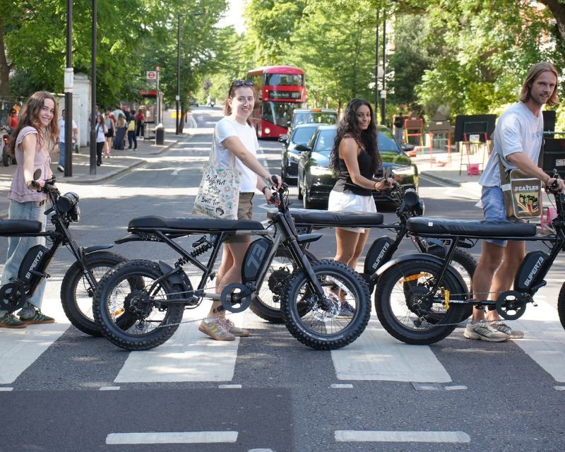 Guests on Super73 e-bikes posing at the Abbey Road crossing during a Beatles London e-bike tour