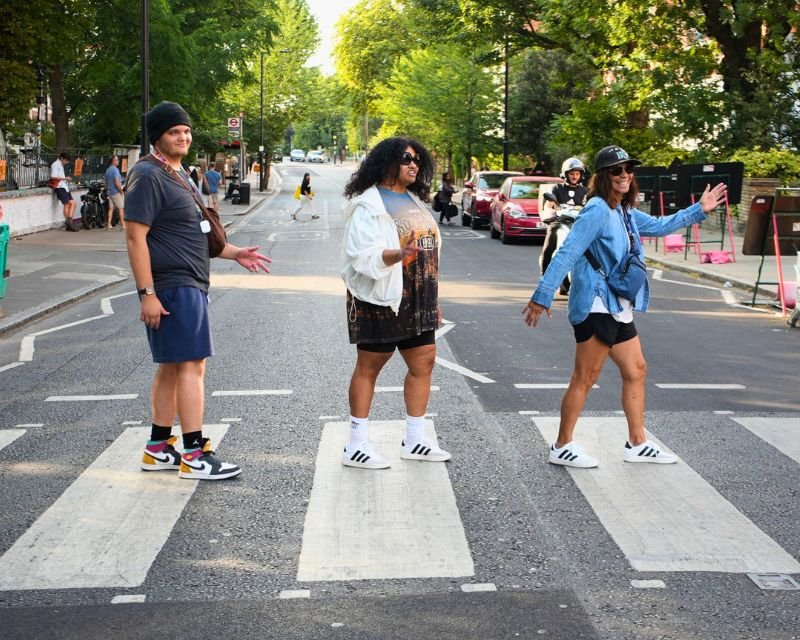 Guests on Super73 e-bikes posing at the Abbey Road crossing during a Beatles London e-bike tour